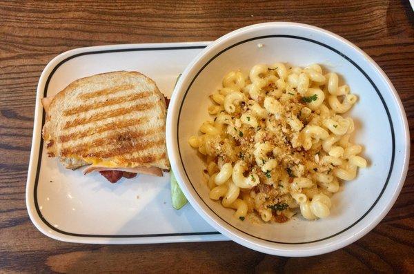 Macaroni and cheese and half of a club Panini