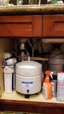 Reverse osmosis system with Insta-hot hiding behind the pipe.