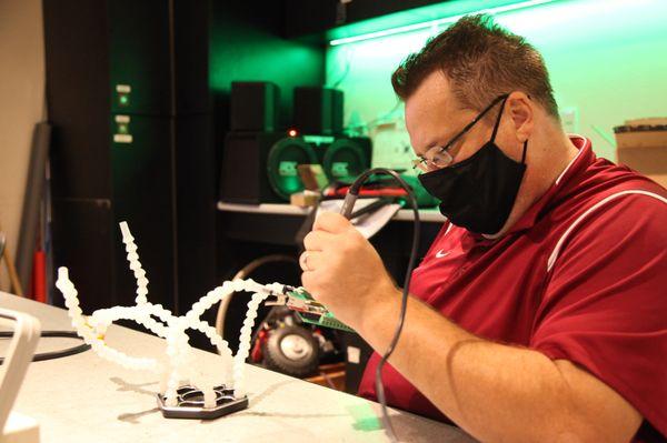 Professor Prater in the Robotics and Embedded Systems lab