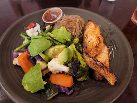 Grilled salmon,  warm veggie medley,  sweet potato noodles with warm spicy teriyaki sauce/dressing.   Avocado always worth the add.