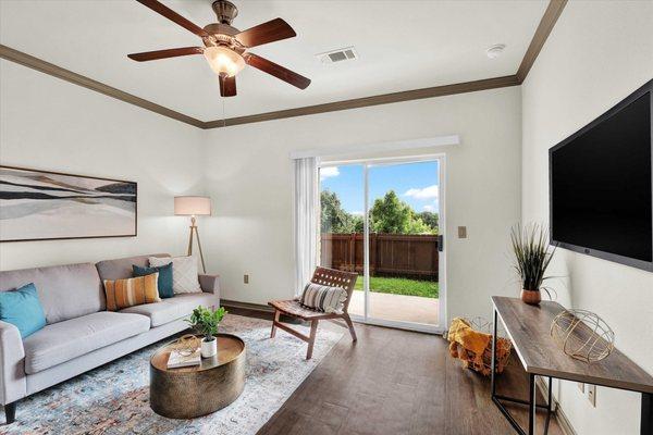 Living room with ceiling fan a Villas at Westover Hills