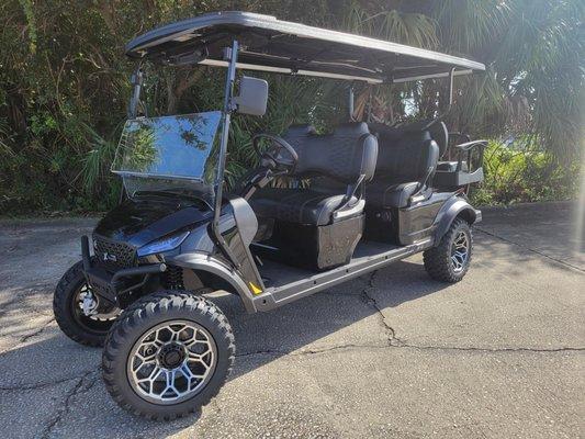 MadJax Xseries X6 lifted 6 passenger lithium golf cart, black metallic