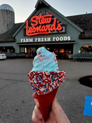 Firecracker Cone-Red velvet cone dipped in white chocolate, sprinkles. - Blue cotton candy ice cream  - Topped w/strawberry pop rocks