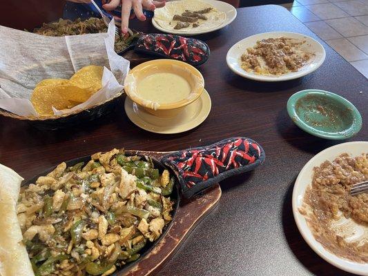 Chicken fajitas, steak fajitas, rice and beans.