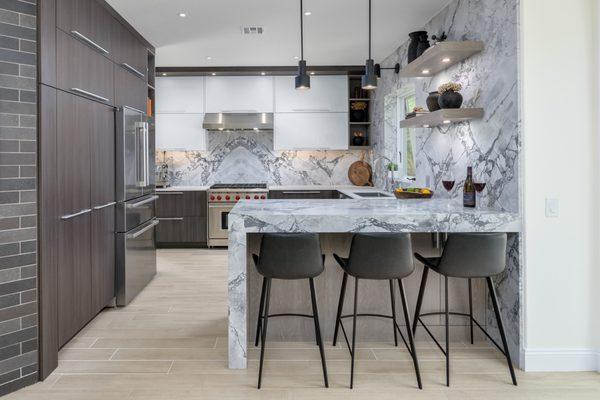 white high gloss upper cabinetry and walnut hued laminate lower cabinetry in Newbury Park kitchen remodel