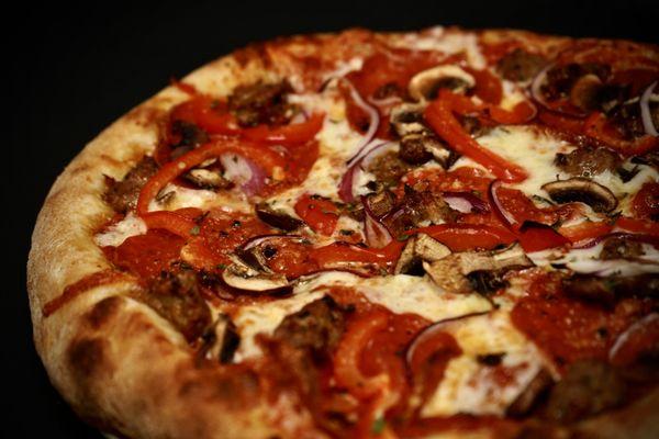 Jaime's Favorite - Pepperoni, House-made Sausage, Mushrooms, Red Onion, Grana and Fresh Herbs on our Classic Cheese