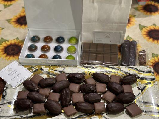 Chocolate covered dates, bonbons, dubai chocolate, perpetual dark chocolate and choco crisp.