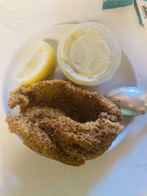 They get a lovely cornmeal crunch on their catfish. Family box has always included tartar sauce but lemons come & go. JUL23