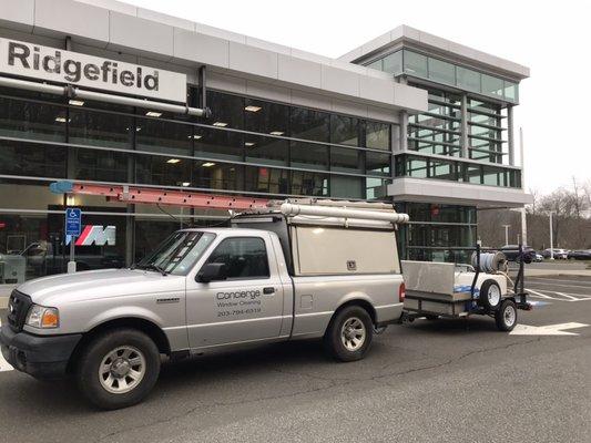 Window and exterior cleaning at a high end auto dealer