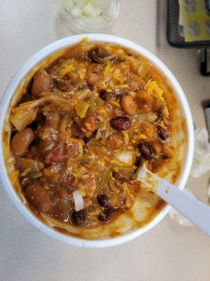 Frito pie with cheese and onions.  Huge serving and fantastic chili