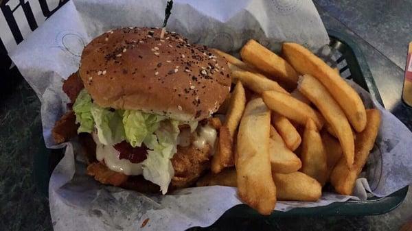 Chicken Sandwich: flash fried or grilled, pepper jack cheese, pickle, bourbon BBQ sauce, tipped with a onion ring.