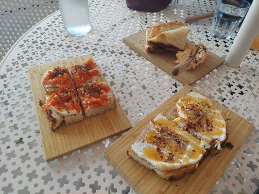 Pan con Tomate (left), Hot Honey Tosta (bottom right), and Pimento Cheese board (upper right)