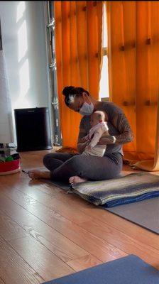 Leonora with my baby at postpartum yoga.