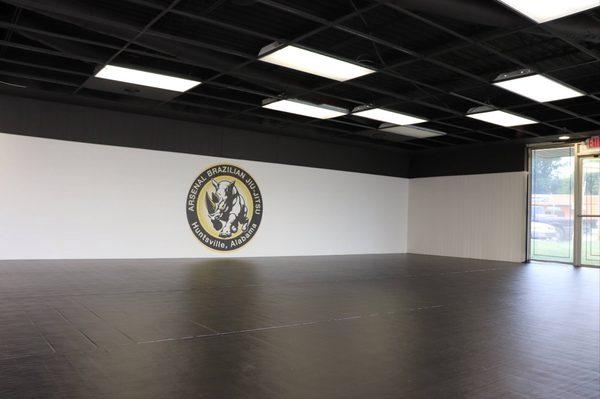 Matted main room of martial arts school.