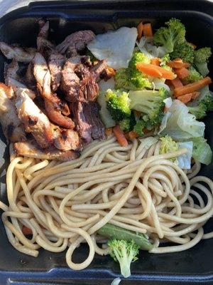 Steak and white meat chicken combo with noodles.