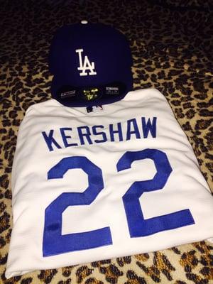 Women's Kershaw jersey and men's dodger hat.