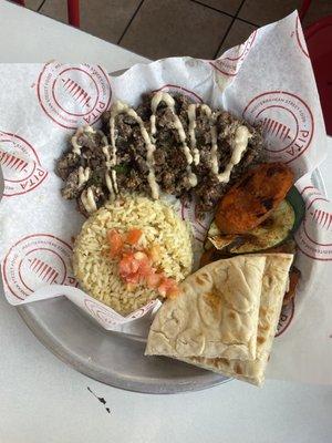 Steak shawarma platter with rice and veggie sides