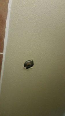 Hole in wall from door