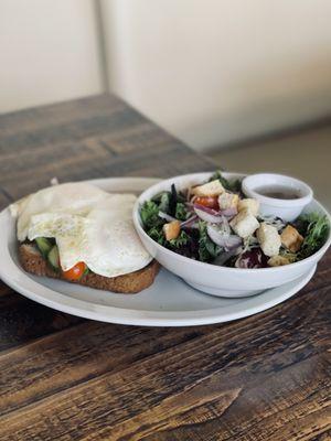 Avocado toast with added egg and side salad with balsamic vinaigrette