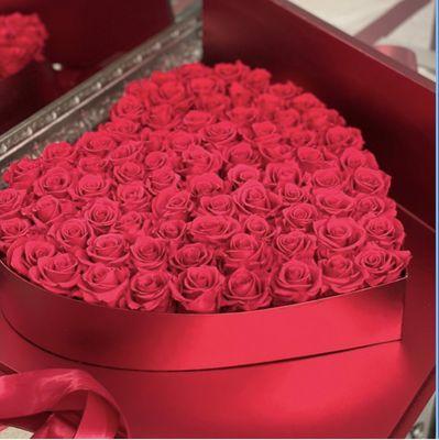 Fifty + long lasting preserved roses in the large acrylic display box. Size: 20" x 20"