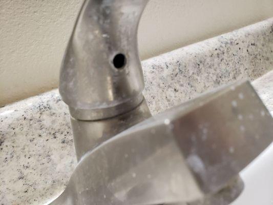 Filthy faucet, couldn't even clean the place after the previous tenant moved out.