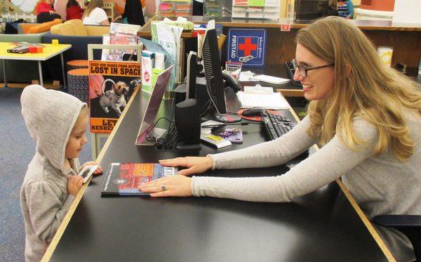 Just one of the wonderful staff members in our Youth Services Department sharing a book.