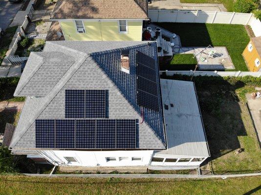 Solar equipment installed on a pitched shingles roof.