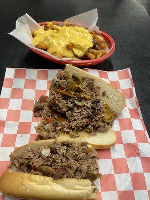 Cheesesteak with cheese fries.