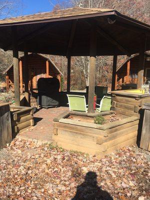 The camp kitchen had a gas grill, a stove top, and a sink available for use.