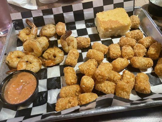 Shrimp platter with tater tots and cornbread.