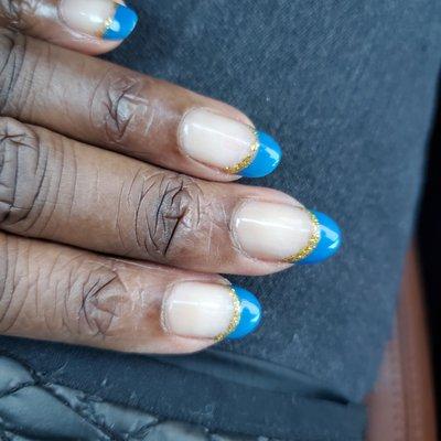 Blue and gold gel nails.