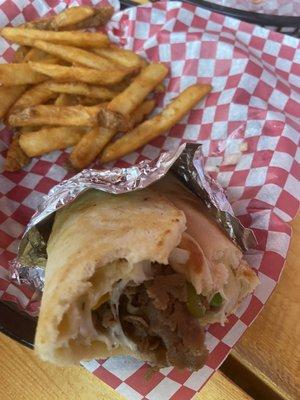 Philly cheese steak wrap and French fries.