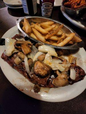 14oz New York Strip with French fries- cooked medium rare, overall delicious and juicy. Next time, would ask to caramelize the onions.