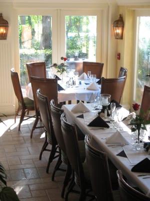 Tarpon Cove Yacht & racquet Club's Main Dining Room offers views of the bay, marina and the Tropical Courtyard