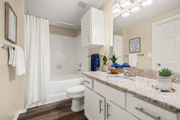 Bathroom with walk in shower and tub at The Lodge at Shavano Park