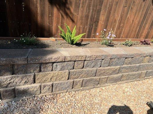 Back retaining wall with planter.