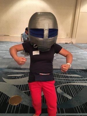 Executive Director, Linda Leu, tries on the suited instructor helmet at Board Match 2016.