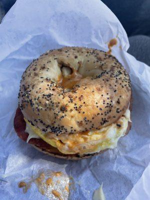 Everything bagel with bacon egg and cheese plus potatoes and chipotle mayo