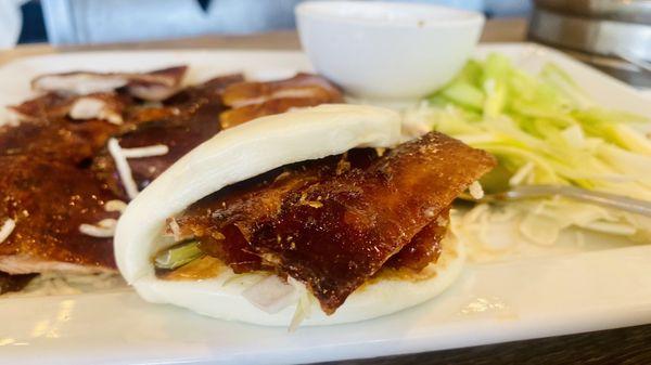 2/2 Peking duck course: crispy skin in bun with green onion and hoisin sauce in a bao bun. $48