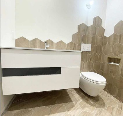 Polygon tile 
Wall mounted toilet and vanity 
Modern look