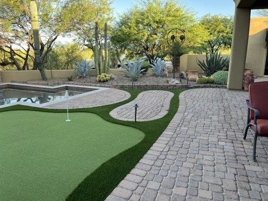 Putting green and small retaining wall installation