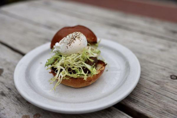 Breakfast sausage and poached egg sandwich