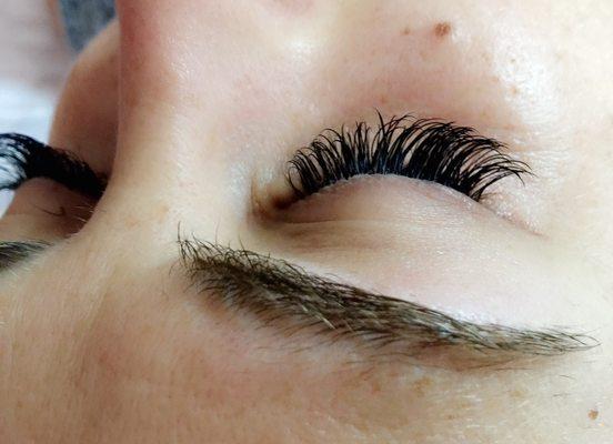 A fresh angle on a fresh Full Set of Classic lashes. Creating a thicker look can easily be done by blending various lash lengths and weight.