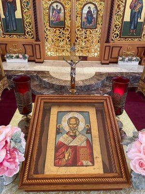 Icon of Saint Nicholas, and other iconography behind it