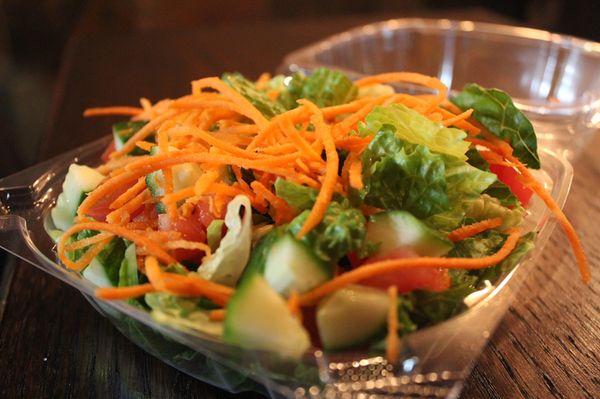 Simple garden salad with fresh vegetables served with a house made sherry vinaigrette.