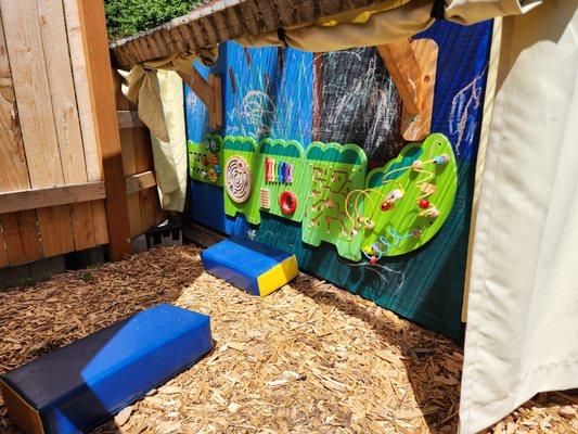 Sensory board in our outdoor Toddler area.