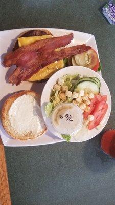 Bacon cheeseburger with side Caesar salad