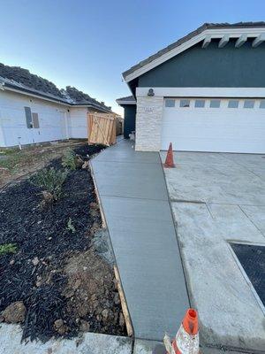 Widened driveway and connected to side of house