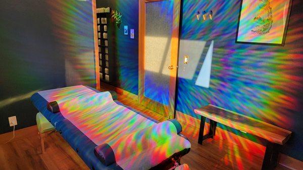 Treatment space, bathed in natural rainbow light.