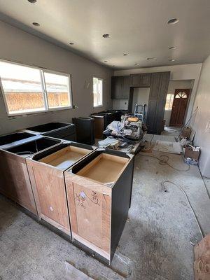 New kitchen layout , removal of wall, new lights and LVT flooring.